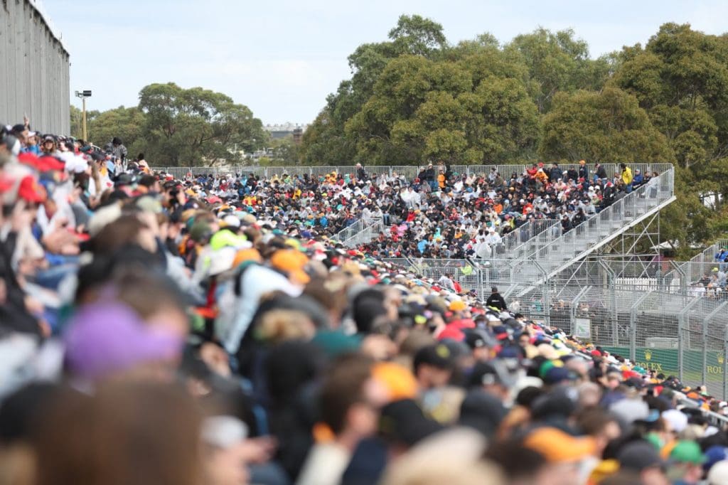 Crowded grandstand at the Australian Grand Prix in Melbourne with fans watching Formula 1 qualifying
